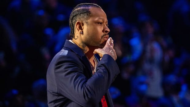 Allen Iverson gestures to the crowd.